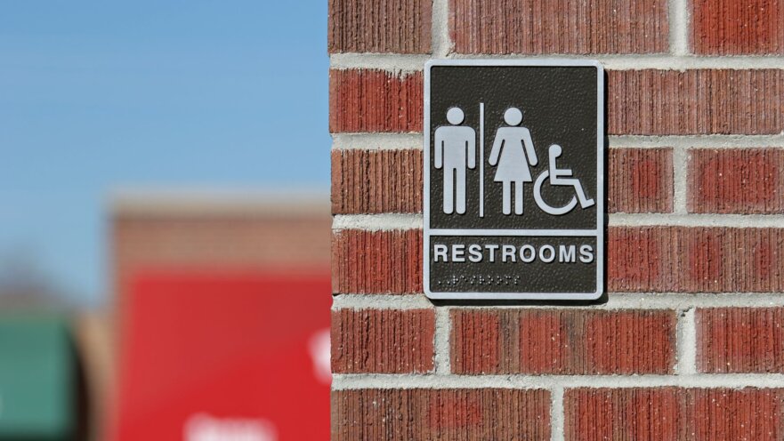 outdoor bathroom restroom sign with braille