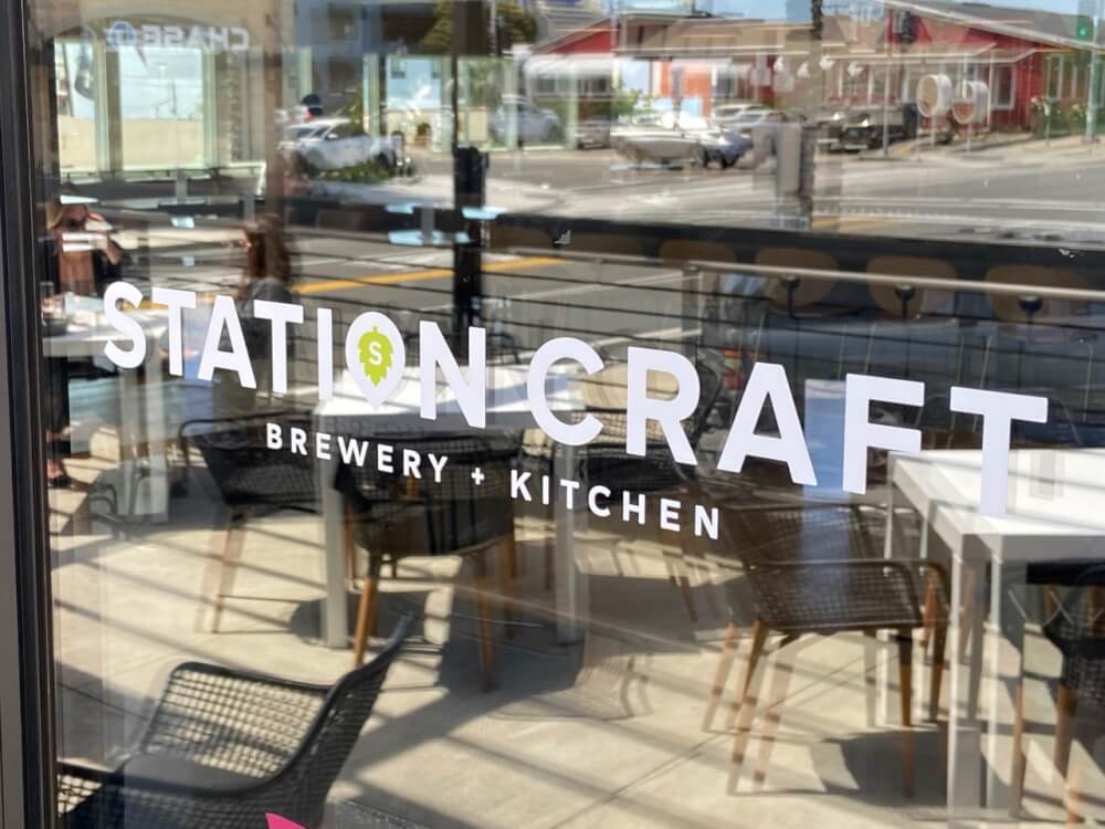 A window graphic for Station Craft Brewery + Kitchen