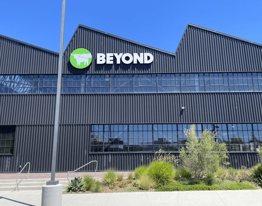 Exterior of industrial building with branded sign -- Beyond Meat logo